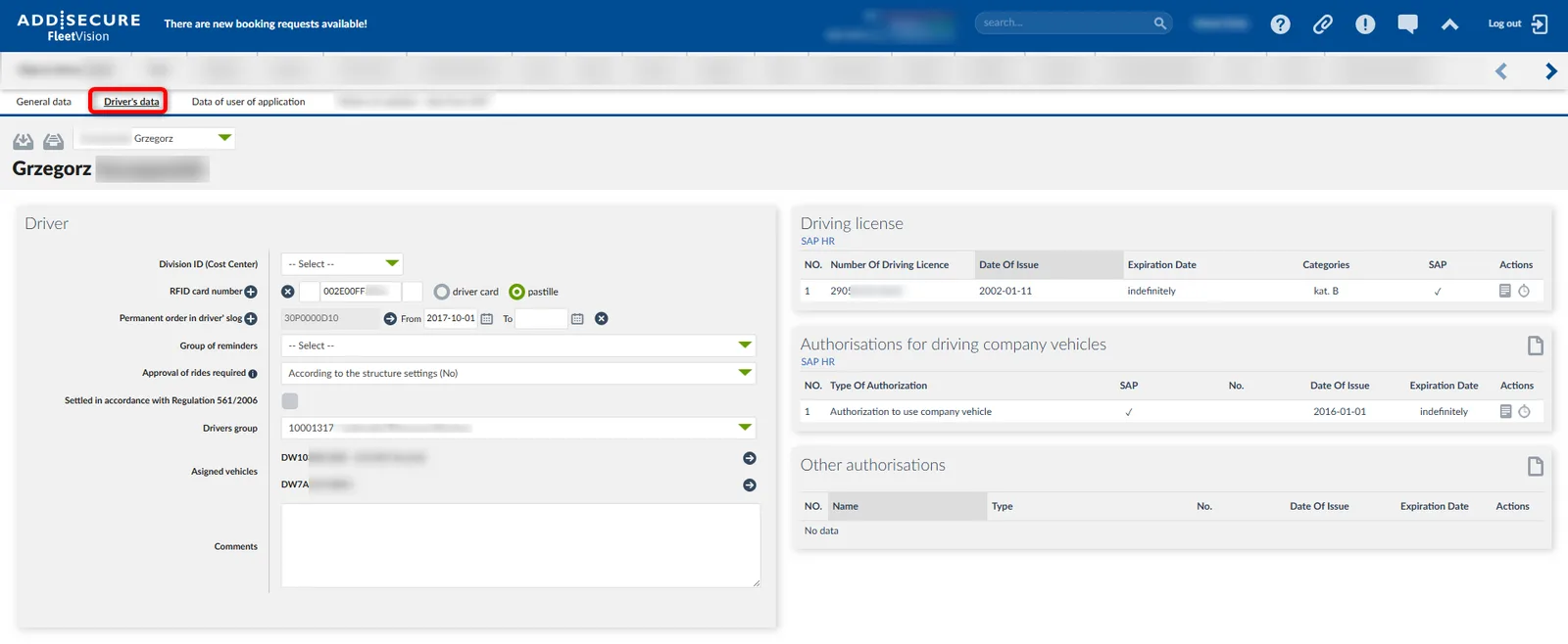 Driver profile page for Grzegorz showing driver information form on the left with RFID card number, permanent order details, reminders group, and assigned vehicles DW10 and DW7A. Right side displays driving license information including license number 2905 issued 2002-01-11 with indefinite expiration, and authorizations for driving company vehicles with authorization to use company vehicle issued 2016-01-01. Other authorizations section shows no data.